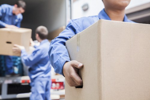 Van moving team preparing equipment for a safe relocation
