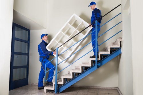 Driver securing furniture inside a moving van