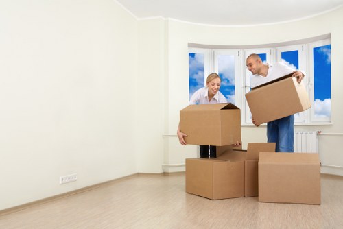 Professional furniture pick-up team loading items in Redbridge