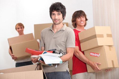 Staff checking load safety before transporting items